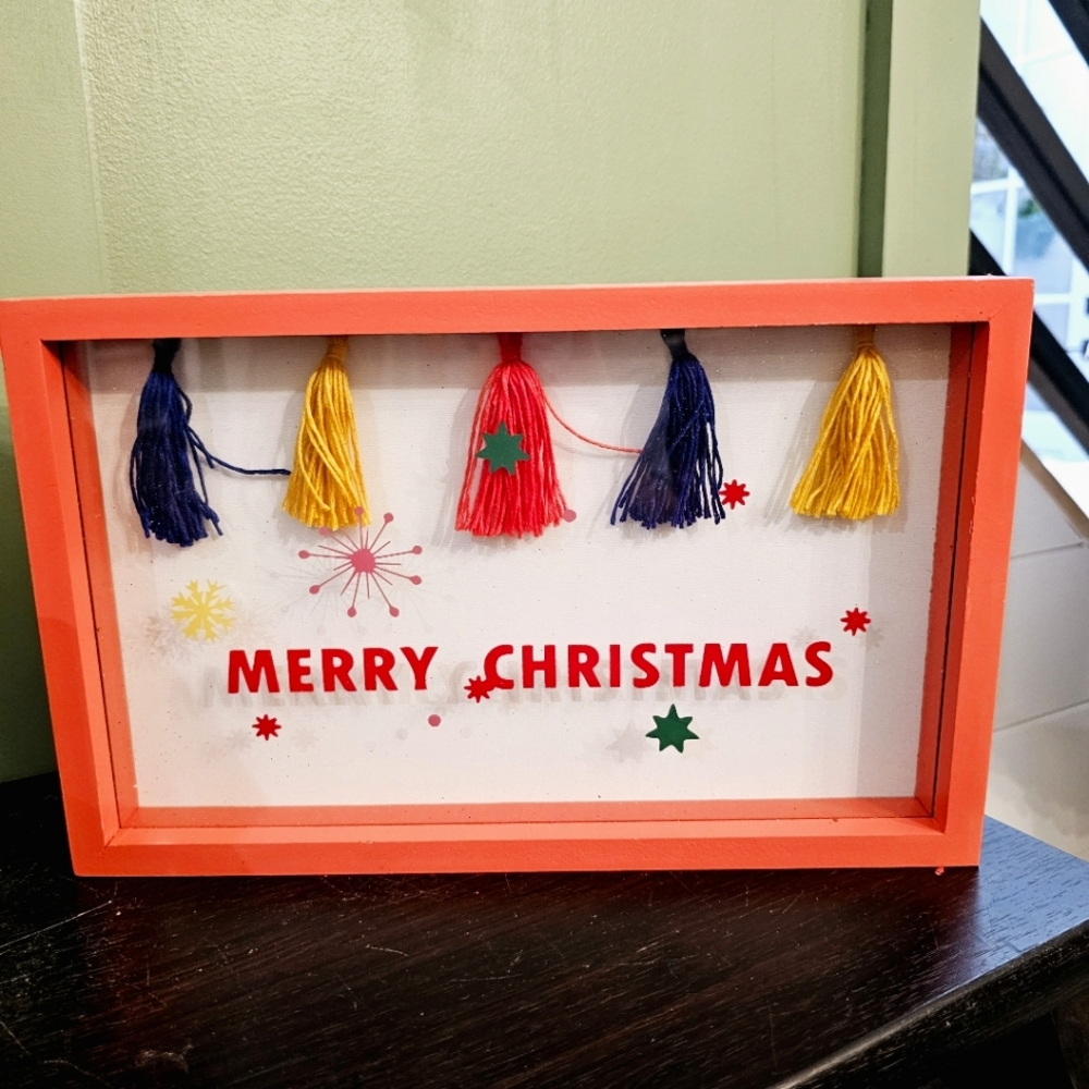 Bright boho Merry Christmas home decor with tassels